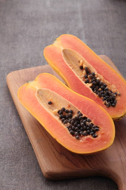 istock ripe and sweet papaya fruit on gray background 1701963192