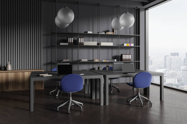 istock Stylish office interior with workspace and chairs in row, panoramic window 1701972157
