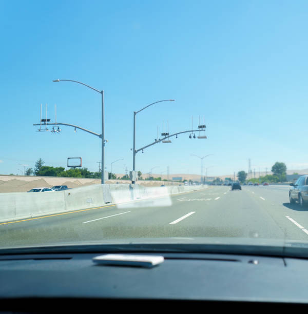 Traffic monitoring security camera CCTV on Express line. California. Vertical format.