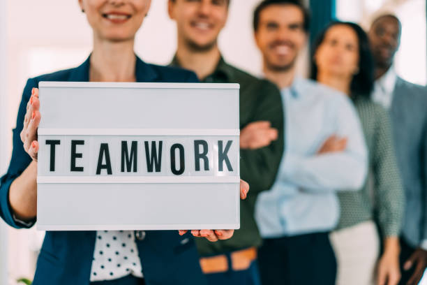 istock Confident businesswoman and her team. 1701982091