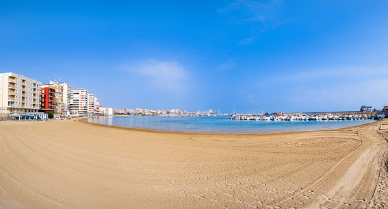 Playa del Acequion, a strip of golden sand in the city of Torrevieja, a tourist destination on the Costa Blanca (5 shots stitched)