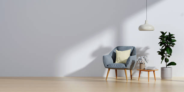 istock Living room with blue fabric armchair on empty white wall background.3d rendering 1701986575