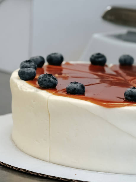 istock Cakes with caramel and blueberries, cut into pieces, close-up 1701992255