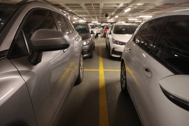 istock Cars in parking garage interior 1701993951