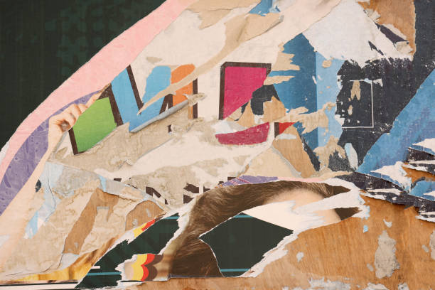 istock Pieces of torn paper peeling off wall used as billboard 1701993968