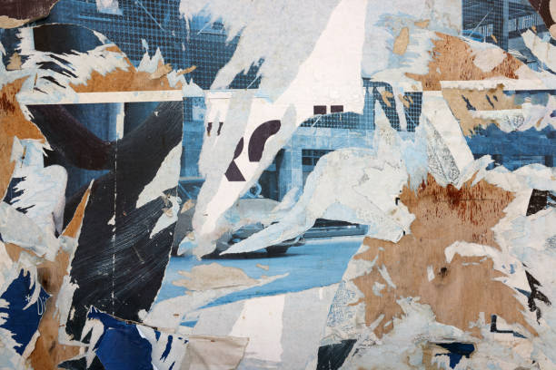 Pieces of torn paper peeling off wall used as billboard