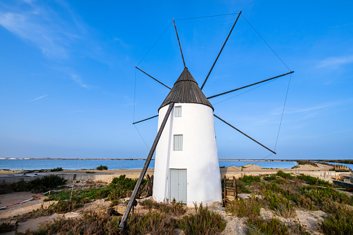 La Calcetera windmill is one of the typical features in the Parque Regional de las Salinas of San Pedro del Pinatar, a small town in the Region of Murcia