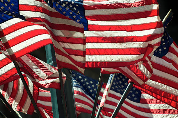 istock Layers of American Flags Wave in Bright Sunshine 170200101