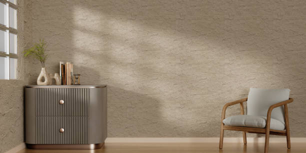 istock Modern minimalist interior with an armchair on empty white wall background. 3D rendering illustration 1702012219