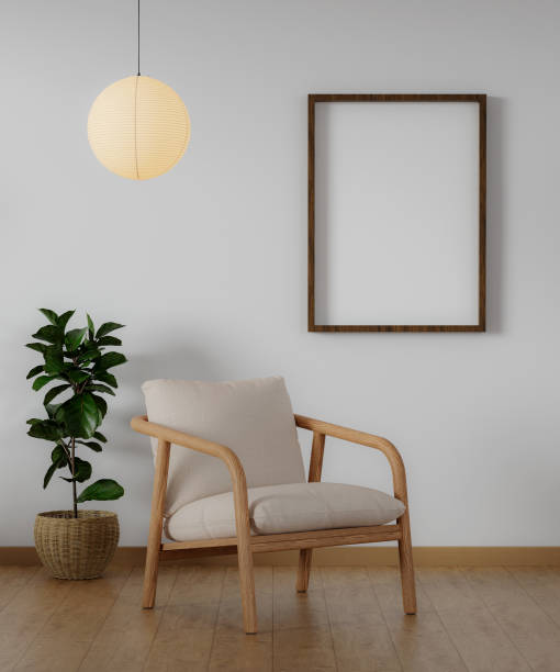 istock Modern minimalist interior with an armchair on empty white wall background and Blank picture frame mockup on white wall. 3d rendering illustration 1702012774