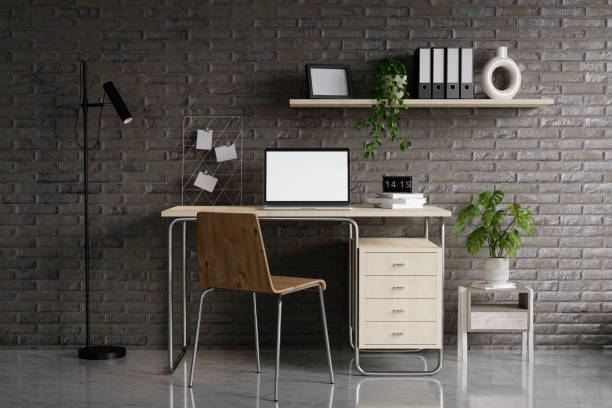 istock Minimalist workspace with a laptop mockup on a table in a minimal office. 3d render illustration 1702021884