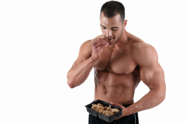délicieux repas - men muscular build body building sensuality photos et images de collection