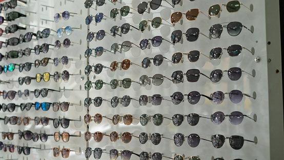 Glasses standing on the shelf in the eyeglasses store