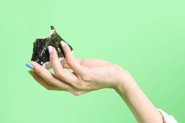 istock Hand Holding Food 1702047666