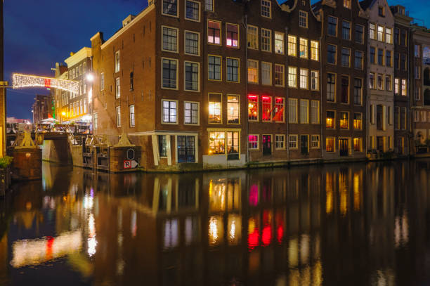istock Amsterdam canals during a winter evening with illuminated merchant's houses 1702049470