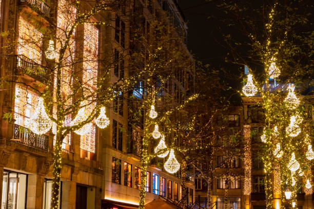 istock Amsterdam Dam square Christmas decorations in the trees 1702050032