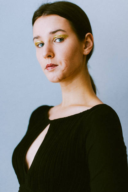 portrait of a young women whit brown hair, blue eyes and a black blouse. - shirt fine art portrait vertical head and shoulders imagens e fotografias de stock