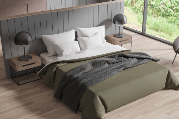 istock Top view of modern bedroom interior with bed and accent wall, panoramic window 1702055971