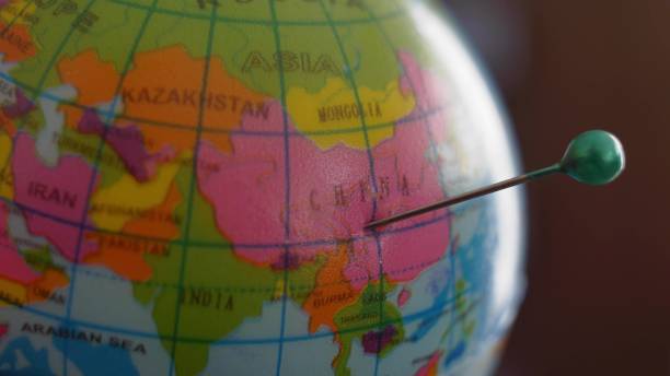 istock Marking China in Asia with Tailor Pin on Globe Ball Close Up 1702057193