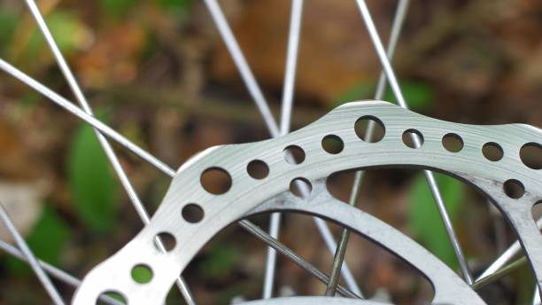 istock Bicycle Wheel Brake Disc and Spokes Rotating Slow Motion 1702058437