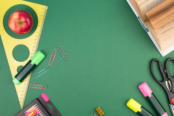 istock Back to school. Stationery on a green table. Office desk with copy space. Flat lay. 1702061809