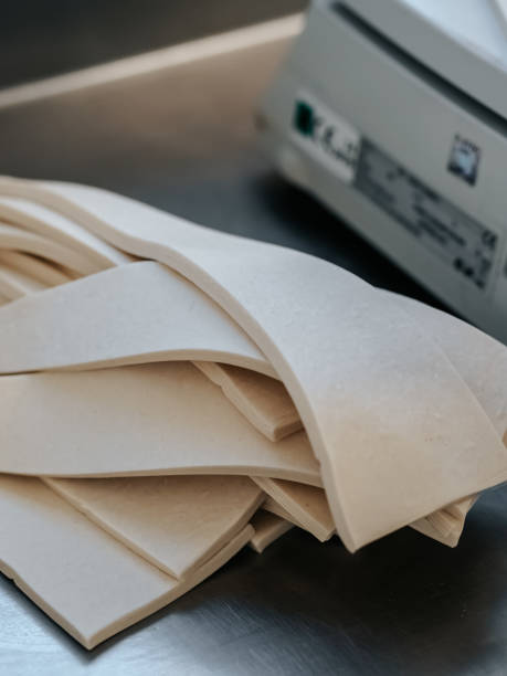 istock Cut triangles of dough for making croissants 1702062229