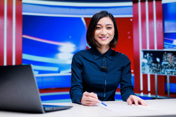 istock Asian presenter on daily newscast 1702065195