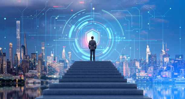 istock Man on stairs looking at data protection interface in night city 1702065736