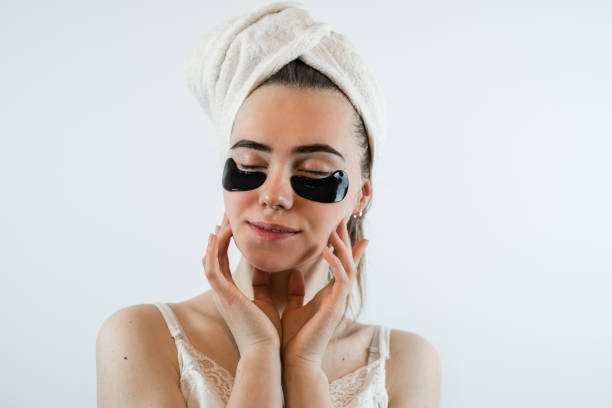 istock young woman with hydrogel eye patches isolated on white 1702080770