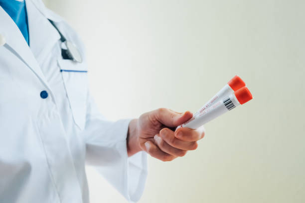 istock Doctor with a positive covid -19 test in hand. 1702085619