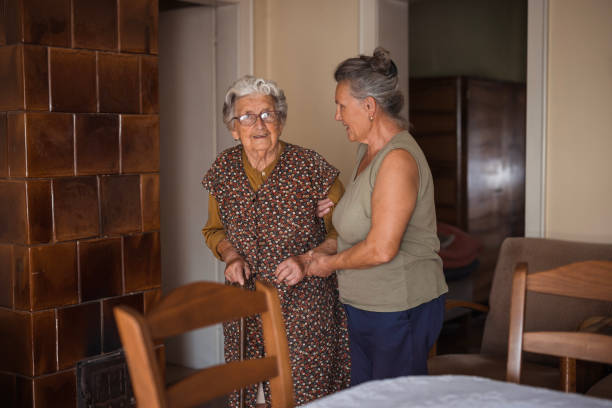 istock Helping hand to senior women at home 1702086509