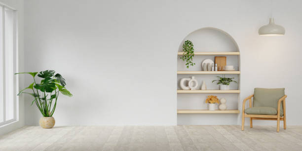 istock Modern minimalist interior with an armchair and plant on empty white wall background.3D rendering 1702108682