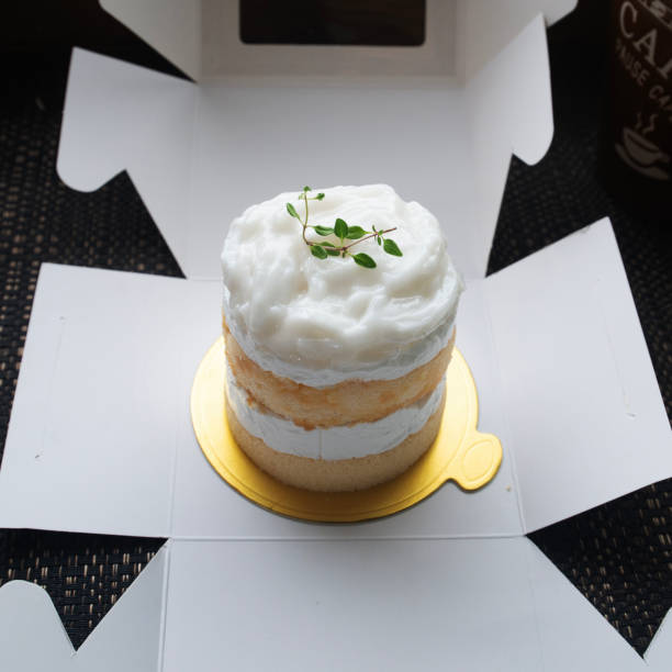 Coconut cake looks delicious placed on cardboard box ready to sending to customer.