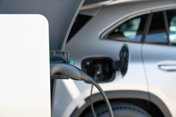 istock Close-up of an electric car with a cable. 1702120212