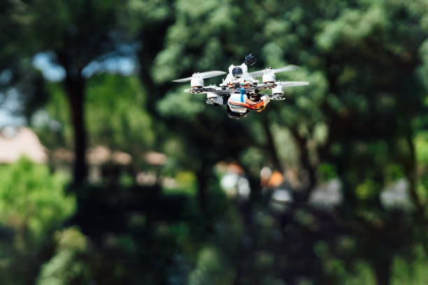 istock Drone flying over the field in the morning with digital camera 1702121370
