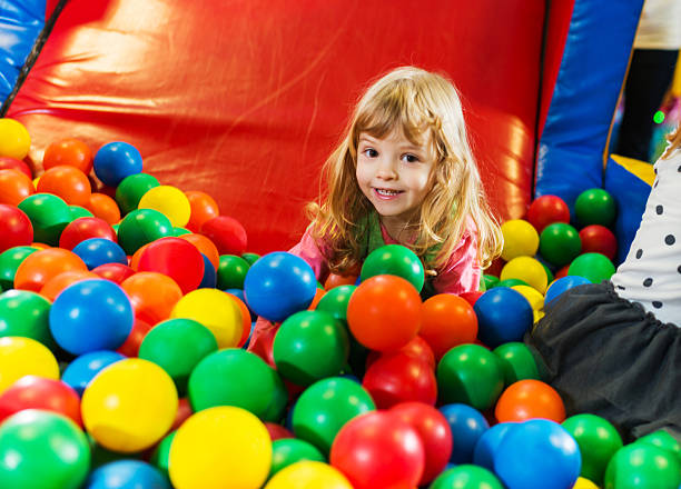 istock Cute girl playing in the ball pool. 170212604