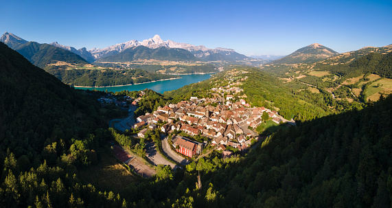 Village of Corps with Sautet Lake and the Obiou peak in Devoluy mountain range. Isere (38), Alps, France