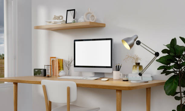 istock Workplace, computer with blank empty white screen display monitor on desk. Mock up, copy space. Home office concept. Business, working from home, studying, e-learning, web site concept. 3D rendering 1702129075