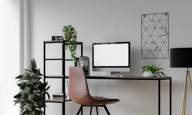 istock PC mockup of blank white screen in contemporary workspace with computer, tablet and phone on black desk and white wall in front view. 3D rendering 1702129612