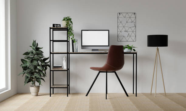 istock PC mockup of blank white screen in contemporary workspace with computer, tablet and phone on black desk and white wall in front view. 3D rendering 1702129980
