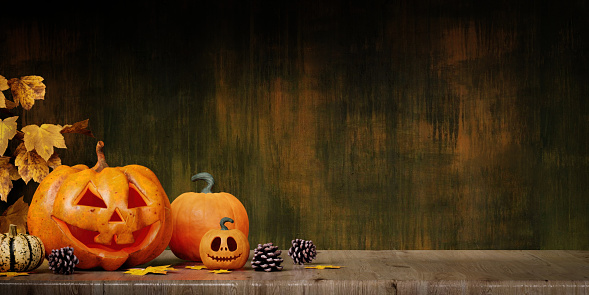 Pumpkins carved for Halloween. on the table in the home. Preparation for holiday. copy space. 3d render..