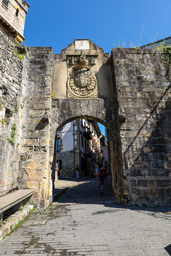 Hondarribia, Gipuzkoa, Spain- August 14, 2023: Defensive wall and gate called Santa Maria in the town of Hondarribia