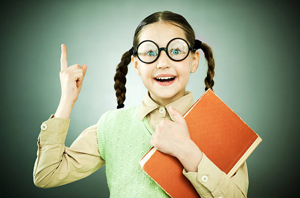 istock Cute geek girl with piggy tail is holding her notebook. 170214754