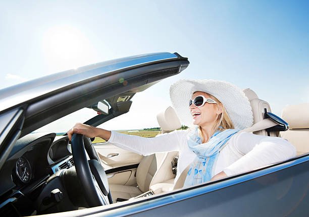 istock Happy woman driving a cabriolet car. 170214755