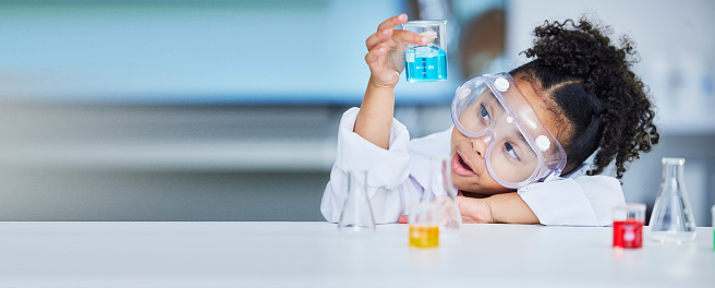 Chemistry, science and a child with liquid for research, futuristic innovation or project for education. Surprise, physics and a girl or young scientist with a test to study water for learning