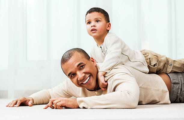 istock Father playing with son at home 170215058