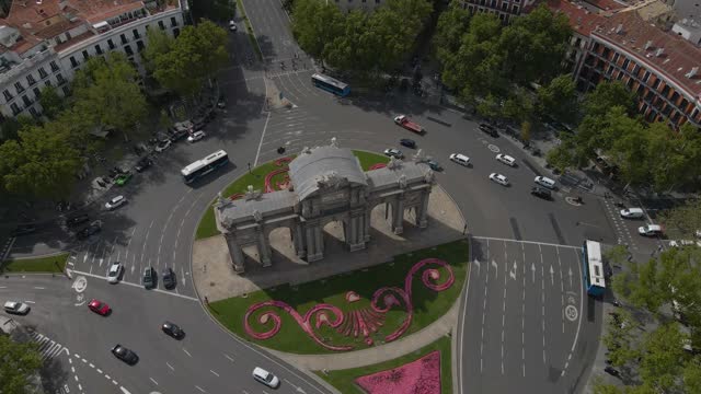 Aerial footage of the roundabout with La Puerta de Alcala in Madrid, Spain, 4k