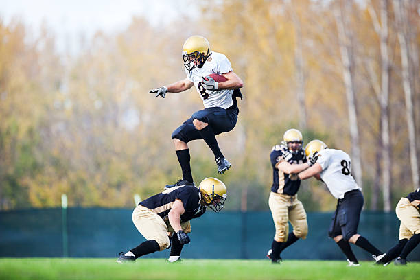 istock College Football - Catch and Tackle. 170215418