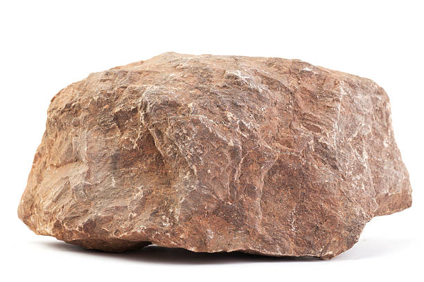 Limestone Big piece of stone isolated on white. Its longest size is appr. 30 cm (12 inch). The type of stone is red limestone. stone object stock pictures, royalty-free photos & images