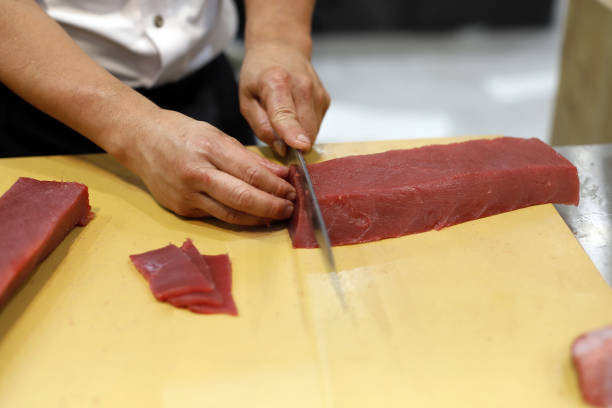 istock chef cutting red tuna for sushi 1702167187